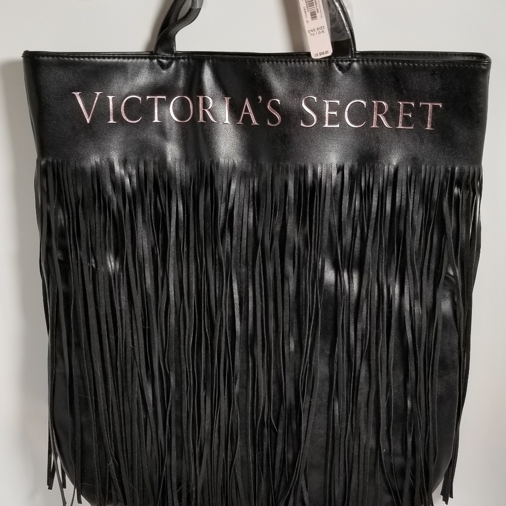 Victoria Secrets black faux leather bag w tassels.